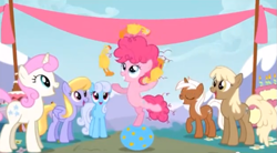 Size: 849x470 | Tagged: safe, screencap, character:cloud kicker, character:linky, character:mjölna, character:pinkie pie, character:shoeshine, character:silver spanner, character:twinkleshine, episode:pinkie pride, g4, my little pony: friendship is magic, background pony, background pony audience, ball, female, filly, filly pinkie pie, frizzy hair, juggling, rubber chicken, younger