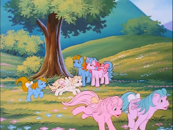 Size: 718x540 | Tagged: safe, screencap, character:baby half note, character:baby lofty, character:baby ribbon, character:baby tiddlywinks, character:buttons (g1), character:ribbon (g1), g1, my little pony 'n friends, flower, hill, laughing, meadow, playing, running, tree