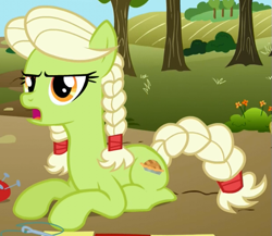 Size: 607x527 | Tagged: safe, screencap, character:granny smith, species:earth pony, species:pony, episode:apple family reunion, g4, my little pony: friendship is magic, braid, braided tail, cropped, female, mare, open mouth, prone, solo, young, young granny smith, younger