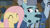 Size: 1964x1094 | Tagged: safe, screencap, character:fluttershy, character:hacksaw mccolt, species:earth pony, species:pegasus, species:pony, episode:the hooffields and mccolts, g4, my little pony: friendship is magic, clothing, discovery family logo, eyes closed, floppy ears, hacksaw mccolt, hat, leadnail mccolt, lip bite, mccolt family, smiling