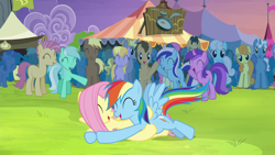 Size: 1920x1080 | Tagged: safe, screencap, character:fluttershy, character:rainbow dash, episode:trade ya, g4, my little pony: friendship is magic, cheering, crowd, glomp, hug, lying down, lying on top of someone, on back