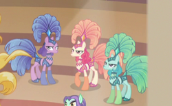 Size: 371x230 | Tagged: safe, screencap, character:emerald flare, character:sapphire sequins, character:sunset circus, species:earth pony, species:pony, episode:viva las pegasus, g4, my little pony: friendship is magic, angry, background pony, cropped, female, mare, midriff, show mares, showgirl, unamused, zen moment