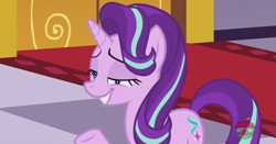 Size: 860x449 | Tagged: safe, screencap, character:starlight glimmer, species:pony, species:unicorn, episode:a royal problem, g4, my little pony: friendship is magic, canterlot castle, carpet, cutie mark, derp, faec, female, grin, hair flip, horn, lidded eyes, raised hoof, smiling, solo, treehouse logo, watermark