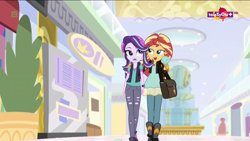 Size: 1600x900 | Tagged: safe, screencap, character:starlight glimmer, character:sunset shimmer, equestria girls:mirror magic, g4, my little pony:equestria girls, bag, beanie, bedroom eyes, boots, clothing, duo, female, food, geode of empathy, hat, ice cream, jacket, leather jacket, lidded eyes, magical geodes, ripped pants, shoes, skirt, vest, walking
