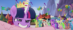 Size: 1920x800 | Tagged: safe, screencap, character:bon bon, character:daisy, character:dawn sunrays, character:minuette, character:red gala, character:sweetie drops, character:twilight sparkle, character:twilight sparkle (alicorn), species:alicorn, species:earth pony, species:pegasus, species:pony, my little pony: the movie (2017), apple family member, background pony, balloon, bunny moon, cornsilk, faec, female, grin, male, mare, market, smiling, stallion, unnamed pony, wind whistler (g4)