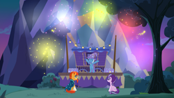 Size: 1920x1080 | Tagged: safe, screencap, character:starlight glimmer, character:sunburst, character:trixie, episode:uncommon bond, g4, my little pony: friendship is magic, cape, caravan, clothing, fireworks, hat, pyrotechnics, stage, trixie's cape, trixie's hat, trixie's wagon, wagon