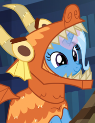 Size: 578x746 | Tagged: safe, screencap, character:trixie, species:dragon, species:pony, species:unicorn, episode:uncommon bond, g4, my little pony: friendship is magic, adorable face, best dragon, board game, clothing, costume, cropped, cute, dawwww, diatrixes, dragon costume, dragon pit, female, glowing horn, hnnng, mare, smiling, solo
