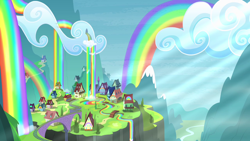 Size: 1280x720 | Tagged: safe, screencap, episode:rainbow falls, g4, my little pony: friendship is magic, building, cloud, crepuscular rays, house, liquid rainbow, mountain, no pony, outdoors, rainbow, rainbow falls (location), rainbow waterfall, scenery, sky, town, train tracks, valley