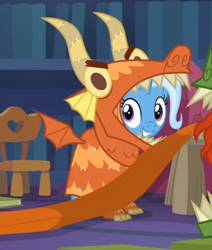 Size: 418x492 | Tagged: safe, screencap, character:trixie, species:pony, species:unicorn, episode:uncommon bond, g4, my little pony: friendship is magic, board game, cute, diatrixes, dragon costume, dragon pit, female, mare, smiling, solo