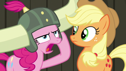 Size: 1280x720 | Tagged: safe, screencap, character:applejack, character:pinkie pie, species:pony, episode:not asking for trouble, g4, my little pony: friendship is magic, helmet, honorary yak horns, horned helmet, viking helmet