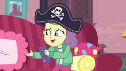 Size: 1920x1080 | Tagged: safe, screencap, episode:pinkie sitting, g4, my little pony:equestria girls, clothing, couch, female, hat, indoors, lily pad (equestria girls), open mouth, pants, phone, pillow, pirate hat, smartphone, solo, young
