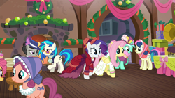Size: 1920x1080 | Tagged: safe, screencap, character:bon bon, character:dj pon-3, character:fluttershy, character:lyra heartstrings, character:octavia melody, character:rarity, character:sweetie drops, character:vinyl scratch, species:earth pony, species:pegasus, species:pony, species:unicorn, episode:a hearth's warming tail, g4, my little pony: friendship is magic, bonnet, bonnie rose, christmas wreath, clothing, dress, female, fire, flutterholly, hat, mare, merry, table, victrola scratch, wreath