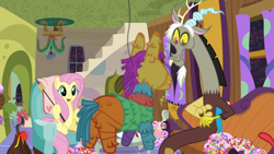 Size: 1280x720 | Tagged: safe, screencap, character:discord, character:fluttershy, species:pony, episode:discordant harmony, g4, my little pony: friendship is magic, candy, food, marshmallow, piñata, smiling, sweets, tea party, volcano
