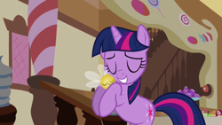 Size: 640x360 | Tagged: safe, screencap, character:twilight sparkle, character:twilight sparkle (unicorn), species:pony, species:unicorn, episode:swarm of the century, g4, my little pony: friendship is magic, eyes closed, nuzzling, parasprite, solo, sugarcube corner