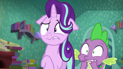 Size: 1280x720 | Tagged: safe, screencap, character:spike, character:starlight glimmer, episode:the crystalling, g4, my little pony: friendship is magic, book, bookshelf, disgusted, door, floppy ears, scroll, shocked