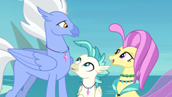 Size: 1920x1080 | Tagged: safe, screencap, character:ocean flow, character:sky beak, character:terramar, species:classical hippogriff, species:hippogriff, species:seapony (g4), episode:surf and/or turf, g4, my little pony: friendship is magic, beach, family, father and son, female, husband and wife, jewelry, male, mother and son, necklace, ocean, rock, smiling