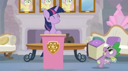 Size: 1654x927 | Tagged: safe, screencap, character:fluttershy, character:spike, character:twilight sparkle, character:twilight sparkle (alicorn), species:alicorn, species:pony, episode:non-compete clause, g4, my little pony: friendship is magic, book, couch, fireplace, wall of shy
