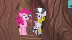 Size: 1280x720 | Tagged: safe, screencap, character:pinkie pie, character:zecora, species:earth pony, species:pony, species:zebra, episode:it isn't the mane thing about you, g4, my little pony: friendship is magic, bottle, door, duo, ear piercing, earring, female, jewelry, leg rings, mane hold, mare, neck rings, piercing, prehensile mane, raised hoof, shampoo