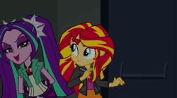 Size: 1280x714 | Tagged: safe, screencap, character:aria blaze, character:sunset shimmer, equestria girls:rainbow rocks, g4, my little pony:equestria girls, canterlot high, clothing, gem, jacket, leather jacket, pigtails, siren gem, twintails, vest