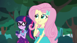 Size: 1280x720 | Tagged: safe, screencap, character:fluttershy, character:twilight sparkle, character:twilight sparkle (scitwi), species:eqg human, episode:text support, g4, my little pony:equestria girls, female, geode of fauna, geode of telekinesis, glasses, hairpin, phone, ponytail, smiling, text support: fluttershy