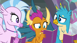 Size: 1280x720 | Tagged: safe, screencap, character:gallus, character:silverstream, character:smolder, species:dragon, species:griffon, species:hippogriff, episode:the end in friend, g4, my little pony: friendship is magic, dragoness, female, jewelry, male, necklace, notebook, raised eyebrow, reading, trio