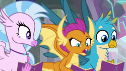 Size: 1280x720 | Tagged: safe, screencap, character:gallus, character:silverstream, character:smolder, species:dragon, species:griffon, species:hippogriff, episode:the end in friend, g4, my little pony: friendship is magic, dragoness, female, jewelry, male, necklace, notebook, open mouth, raised eyebrow, spread wings, wings