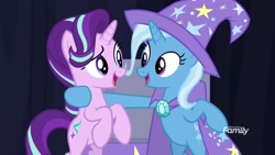 Size: 1920x1080 | Tagged: safe, screencap, character:starlight glimmer, character:trixie, species:pony, species:unicorn, episode:on the road to friendship, bipedal, bipedal leaning, cape, clothing, duo, eye contact, female, hat, leaning, looking at each other, mare, trixie's cape, trixie's hat