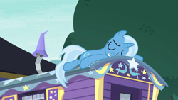 Size: 1280x720 | Tagged: safe, screencap, character:trixie, species:pony, species:unicorn, episode:on the road to friendship, eyes closed, female, mare, prone, smiling, solo, trixie's wagon