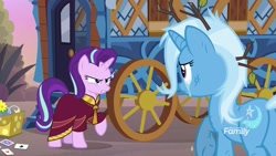 Size: 1920x1080 | Tagged: safe, screencap, character:starlight glimmer, character:trixie, species:pony, species:unicorn, episode:on the road to friendship, clothing, crying, discovery family logo, duo, female, hoo'far's wagon, mare, raised hoof, robe, teary eyes, underhoof
