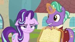 Size: 1366x768 | Tagged: safe, screencap, character:firelight, character:starlight glimmer, episode:the parent map, g4, book, father and daughter, female, floppy ears, magic, male, sire's hollow, starlight is not amused, unamused