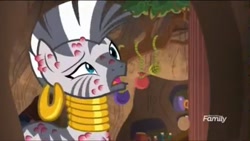 Size: 1037x585 | Tagged: safe, screencap, character:zecora, species:pony, species:zebra, episode:a rockhoof and a hard place, g4, my little pony: friendship is magic, bee sting, ear piercing, earring, female, jewelry, mare, neck rings, pain, piercing, raised eyebrow, why