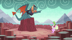 Size: 1024x575 | Tagged: safe, screencap, character:dragon lord torch, species:dragon, episode:father knows beast, g4, my little pony: friendship is magic, dragon lands, dragoness, duo, female, horn ring, male, pointing, solo, spike's fake mother