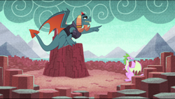 Size: 1024x579 | Tagged: safe, screencap, character:dragon lord torch, species:dragon, episode:father knows beast, g4, my little pony: friendship is magic, dragon lands, dragoness, duo, female, male, pointing, solo, spike's fake mother