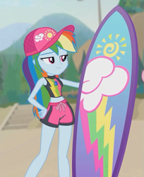 Size: 585x718 | Tagged: safe, screencap, character:rainbow dash, episode:blue crushed (a.k.a baewatch), g4, my little pony:equestria girls, belly button, cap, clothing, cropped, female, geode of super speed, hat, legs, magical geodes, midriff, shorts, smiling, surfboard, swimsuit