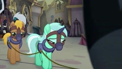 Size: 613x345 | Tagged: safe, screencap, character:lyra heartstrings, character:songbird serenade, species:earth pony, species:pony, species:unicorn, my little pony: the movie (2017), bound together, cage, collar, cropped, female, harness, horn cap, magic suppression, male, mare, muzzle, sad, slavery, stallion, tack