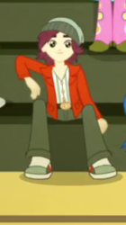 Size: 217x388 | Tagged: safe, screencap, character:normal norman, character:paisley, episode:steps of pep, eqg summertime shorts, g4, my little pony:equestria girls, background human, clothing, cropped, male, offscreen character, pants, shoes, sitting, smiling, sneakers, solo