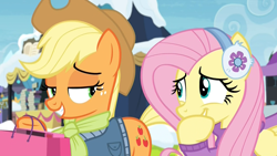 Size: 1920x1080 | Tagged: safe, screencap, character:applejack, character:fluttershy, species:earth pony, species:pegasus, species:pony, episode:best gift ever, g4, my little pony: friendship is magic, applejack's hat, clothing, cowboy hat, cute, duo, earmuffs, eye contact, female, giggling, grin, hat, hoof over mouth, jacket, laughing, lidded eyes, looking at each other, mare, rainbow falls (location), scarf, shopping bags, shyabetes, smiling, snow, sweater