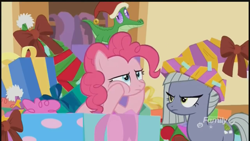 Size: 1280x720 | Tagged: safe, screencap, character:limestone pie, character:pinkie pie, species:earth pony, species:pony, episode:best gift ever, g4, my little pony: friendship is magic, alligator, christmas, clothing, decoration, discovery family logo, female, hat, holiday, limestone is not amused, male, mare, santa hat, sisters, unamused