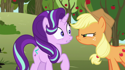 Size: 1280x720 | Tagged: safe, screencap, character:applejack, character:starlight glimmer, species:earth pony, species:pony, species:unicorn, episode:no second prances, g4, my little pony: friendship is magic, angry, apple, apple tree, applejack's hat, bags under eyes, clothing, cowboy hat, duo, female, food, freckles, glare, hat, looking at each other, mare, nervous, ponytail, raised hoof, squint, stetson, sweet apple acres, tree