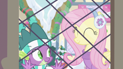 Size: 1280x720 | Tagged: safe, screencap, character:fluttershy, character:spike, species:dragon, species:pegasus, species:pony, episode:best gift ever, g4, my little pony: friendship is magic, clothing, cute, duo, earmuffs, eyes closed, female, hat, male, mare, scarf, shyabetes, snow, window