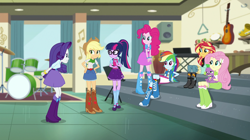 Size: 1912x1072 | Tagged: safe, screencap, character:applejack, character:fluttershy, character:pinkie pie, character:rainbow dash, character:rarity, character:spike, character:spike (dog), character:sunset shimmer, character:twilight sparkle, character:twilight sparkle (scitwi), species:dog, species:eqg human, equestria girls:dance magic, g4, my little pony:equestria girls, angry, belt, boots, canterlot high, clothing, compression shorts, cowboy hat, cymbals, denim skirt, drum kit, drums, female, freckles, glasses, group, guitar, hand on hip, hat, high heel boots, humane five, humane seven, humane six, keyboard, maracas, mary janes, musical instrument, ponytail, saxophone, shoes, shorts, sitting, skirt, socks, stairs, stetson, striped socks, tambourine, triangle, xylophone
