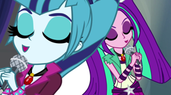 Size: 1280x714 | Tagged: safe, screencap, character:aria blaze, character:sonata dusk, equestria girls:rainbow rocks, g4, my little pony:equestria girls, duo, duo female, eyes closed, female, gem, microphone, pigtails, ponytail, singing, siren gem, twintails