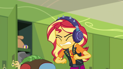 Size: 1920x1080 | Tagged: safe, screencap, character:sandalwood, character:sunset shimmer, episode:overpowered, g4, my little pony:equestria girls, background human, canterlot high, clothing, cringing, eyes closed, geode of empathy, gritted teeth, hackysack, hallway, headphones, jacket, leather jacket, lockers, magical geodes