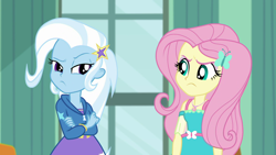 Size: 1920x1080 | Tagged: safe, screencap, character:fluttershy, character:trixie, episode:a little birdie told me, g4, my little pony:equestria girls, angry, annoyed, barrette, butterfly, canterlot high, classroom, clothing, crossed arms, dress, duo, female, frown, geode of fauna, hairclip, hoodie, looking at each other, madorable, magical geodes, pouting, raised eyebrow, rivalry, skirt, standoff, stars, window
