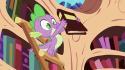 Size: 987x554 | Tagged: safe, screencap, character:spike, species:dragon, episode:the cutie pox, g4, my little pony: friendship is magic, book, claws, cute, golden oaks library, ladder, male, smiling, solo