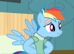 Size: 931x676 | Tagged: safe, screencap, character:rainbow dash, species:pegasus, species:pony, episode:read it and weep, g4, my little pony: friendship is magic, bandage, cropped, female, hooves on hips, hospital gown, mare, messy mane, nervous grin, solo