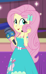 Size: 594x939 | Tagged: safe, screencap, character:fluttershy, episode:best in show: the victory lap, g4, my little pony:equestria girls, beautiful, cropped, cute, geode of fauna, magical geodes, microphone, playing with hair, shyabetes, smiling