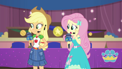 Size: 1920x1080 | Tagged: safe, screencap, character:applejack, character:fluttershy, episode:best in show: the victory lap, g4, my little pony:equestria girls, applejack's hat, clothing, cowboy hat, female, geode of fauna, geode of super strength, hat, magical geodes, microphone