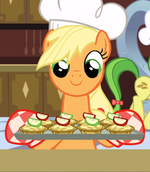 Size: 816x938 | Tagged: safe, screencap, character:applejack, species:earth pony, species:pony, episode:a canterlot wedding, g4, my little pony: friendship is magic, apple fritter (food), baking sheet, chef's hat, clothing, cropped, cute, female, food, hat, jackabetes, mare, oven mitts, smiling, solo focus