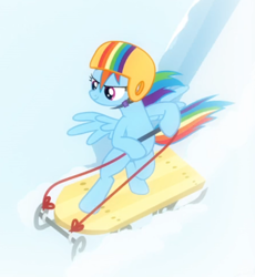Size: 578x627 | Tagged: safe, screencap, character:rainbow dash, species:pegasus, species:pony, episode:tanks for the memories, g4, my little pony: friendship is magic, bipedal, cropped, female, helmet, mare, sled, sledding, solo, spread wings, wings